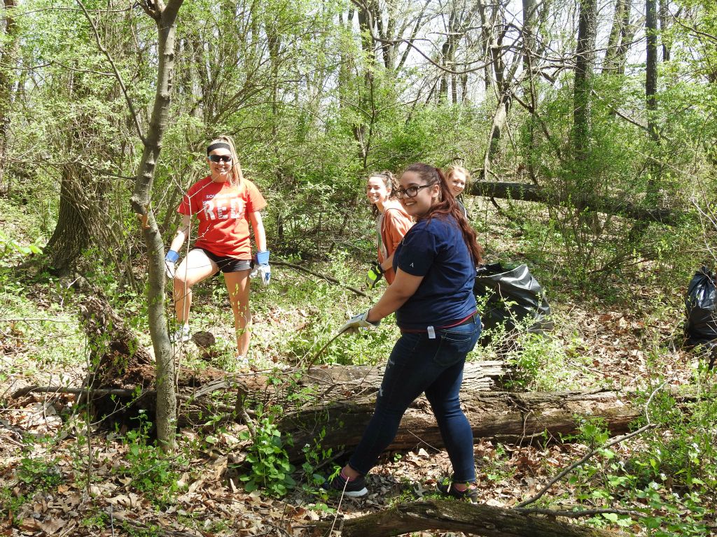 Conducting research at the wooded preserve on campus